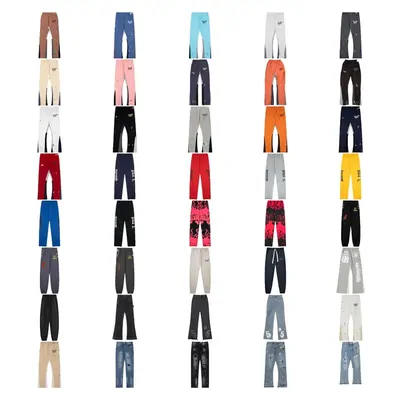 Dozens of pairs of jeans in different washes arranged in five columns on white