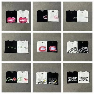 Nine printed t-shirts in black and white arranged in a three by three grid